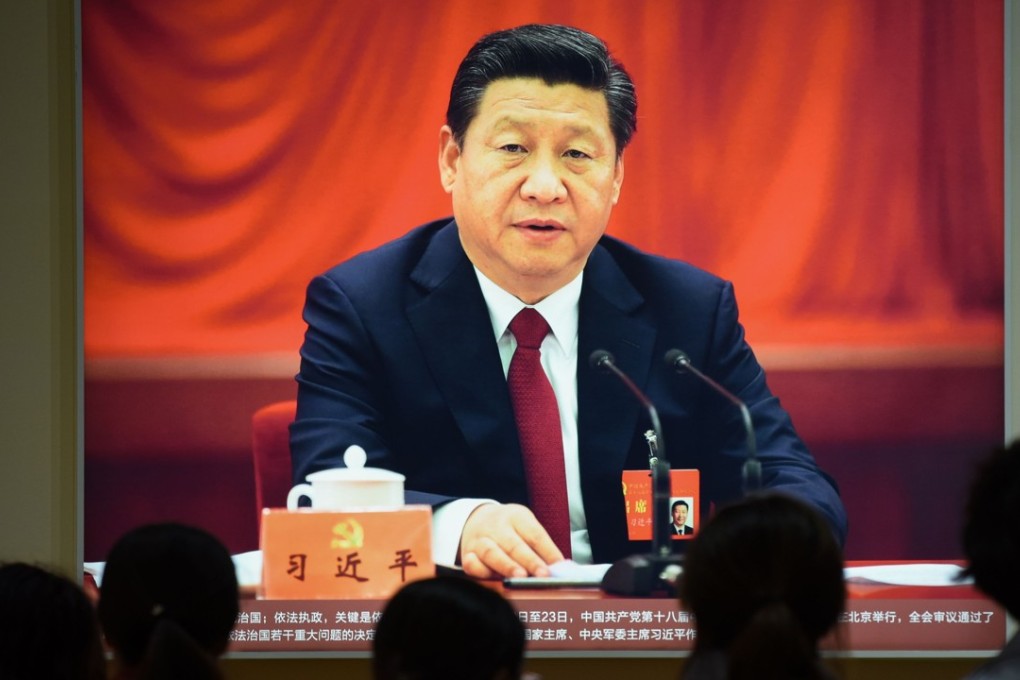 A portrait of Chinese President Xi Jinping is displayed at an exhibition in Beijing showcasing China's progress in the past five years, ahead of the 19th party congress that will begin next week. Photo: AFP