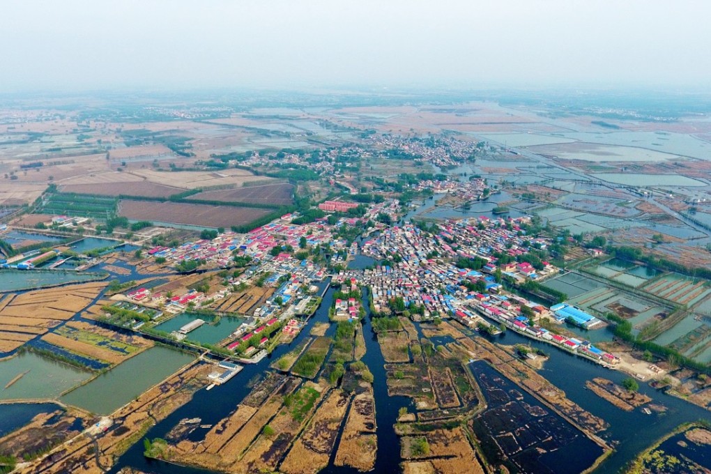 Aerial view of a village in Baiyangdian, one of the largest freshwater wetlands in north China, in Anxin County, north China's Hebei Province. China announced the plan for Xiongan New Area officially on April 1, 2017. The new area will span Xiongxian, Rongcheng and Anxin counties in Hebei Province, eventually covering 2,000 square kilometers. Photo: Xinhua.