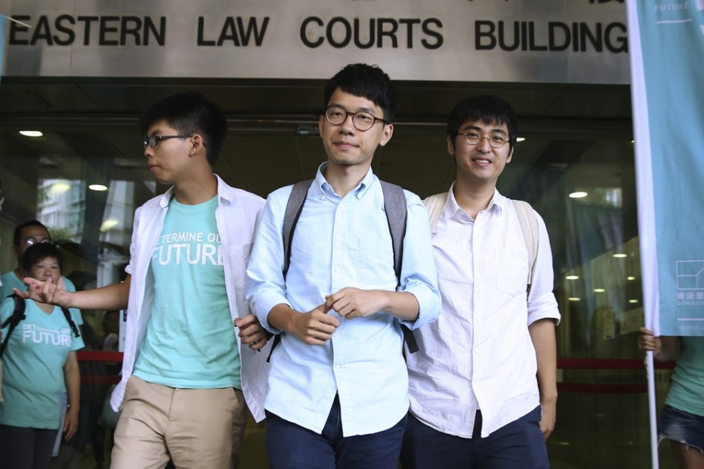 Occupy Central student leaders Joshua Wong Chi-fung, Nathan Law Kwun-chung and Alex Chow Yong-kang, seen here outside the magistrates’ courts in July last year, were convicted by a magistrate and originally given non-custodial sentences. Photo: Sam Tsang.