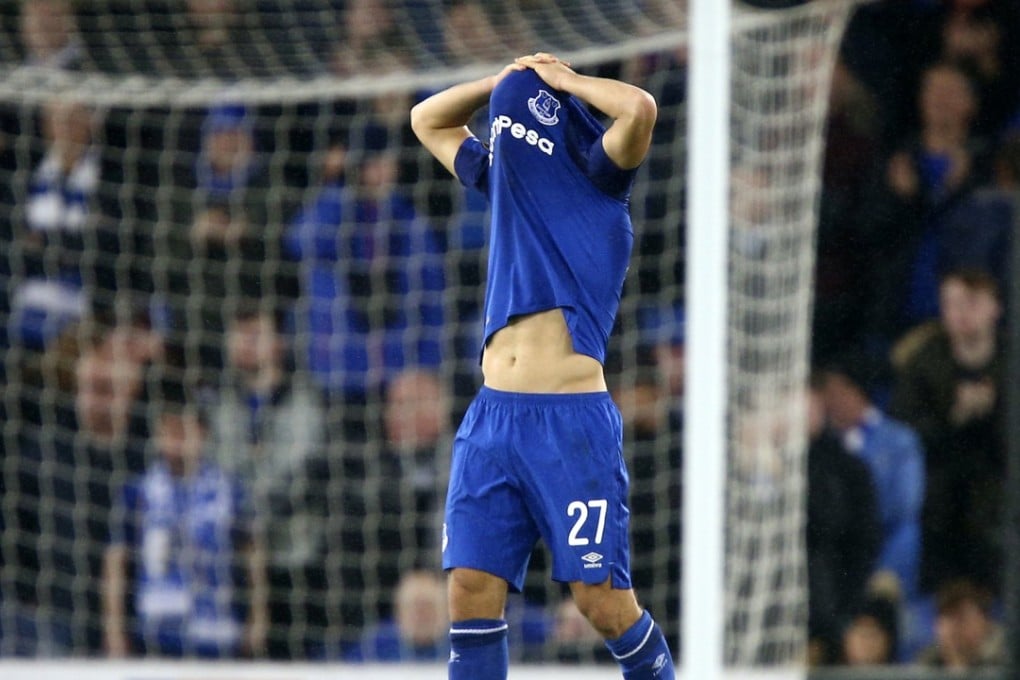 Everton’s Nikola Vlasic hides under his shirt after losing the Europa League clash against Lyon. Photo: AP
