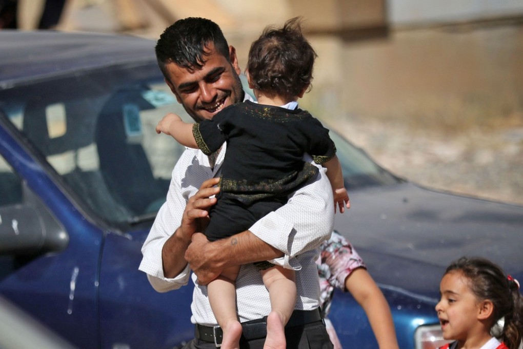 Displaced Iraqi Kurds fleeing violence in northern Kirkuk province are seen at an unfinished public housing estate where they are taking shelter in Arbil, the capital of the autonomous Kurdish region of northern Iraq, on October 19, 2017. Photo: Agence France-Presse