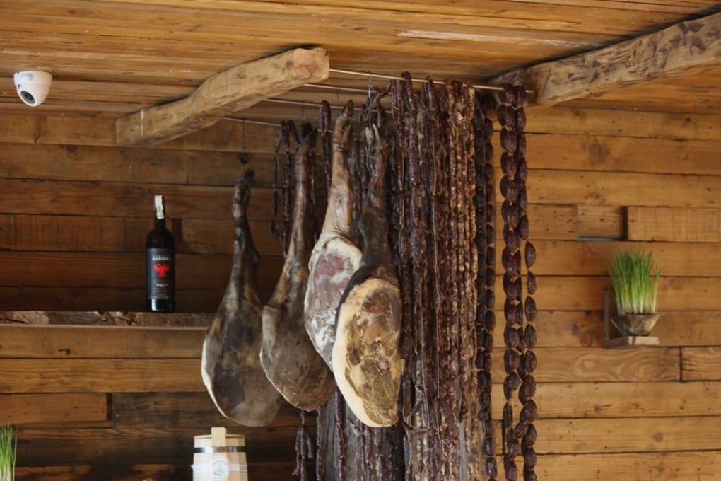 Cured meats air drying in the rustic dining room at Mullixhiu in the Albanian capital, Tirana. Photo: Mullixhiu