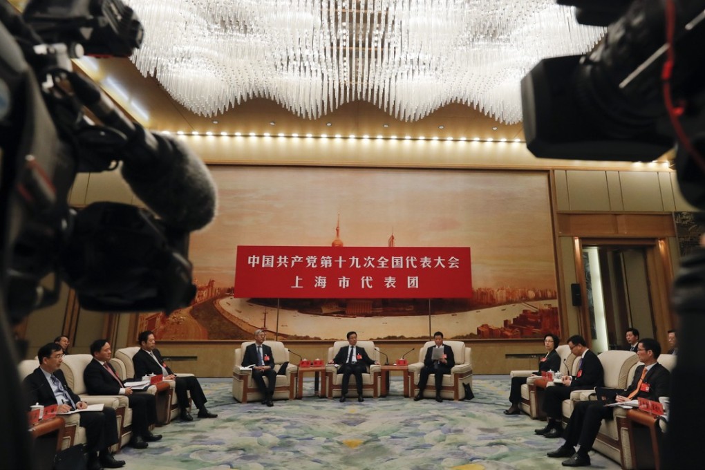 The Shanghai delegation, including party chief Han Zheng (centre) and mayor Ying Yong (right) discuss Xi Jinping’s work report at the Great Hall of the People in Beijing on Thursday. Photo: AP