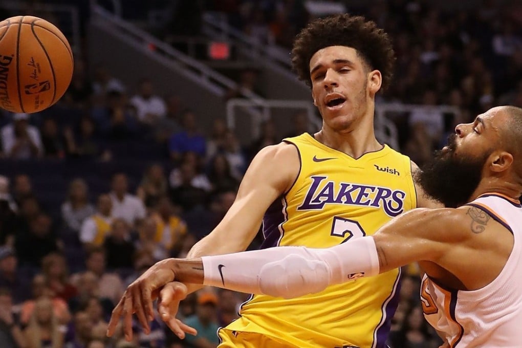 Lonzo Ball of the Los Angeles Lakers drives against Tyson Chandler the Phoenix Suns. Photo: AFP