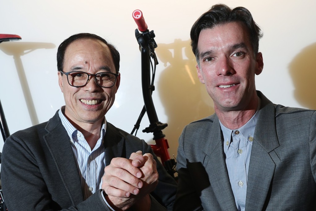 Hong Kong-raised cyclist David Millar with ‘Mr Lee’, the owner of Flying Ball Bicycle in Kowloon. Photo: K. Y. Cheng
