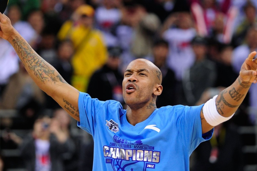 Stephon Marbury celebrating after his team, the Beijing Ducks, won their first-ever Chinese championship. Photo: AFP
