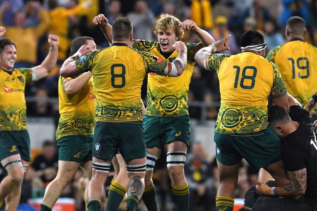 Wallabies players celebrate winning their third Bledisloe Cup. Photo: Reuters