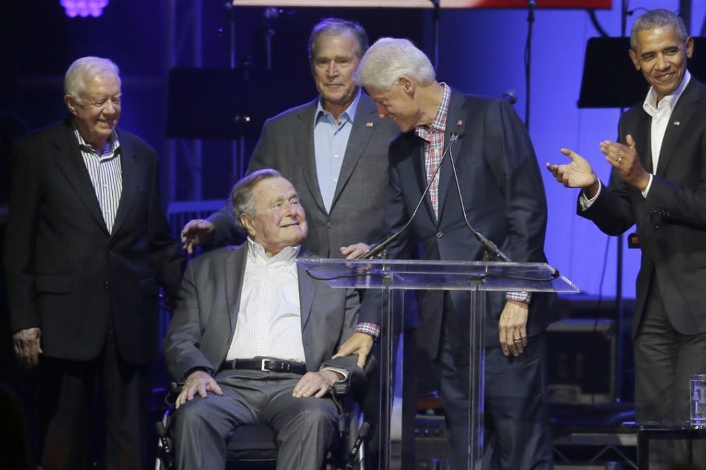 Former presidents from right, Barack Obama, Bill Clinton, George W. Bush, George H.W. Bush and Jimmy Carter gather on stage during a hurricanes relief concert in College Station, Texas. Photo: AP