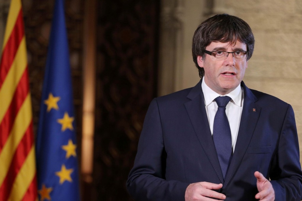 Catalan President Carles Puigdemont gives a speech at the Palau de la Generalitat, the regional government headquarters in Barcelona, Spain. Photo: Reuters