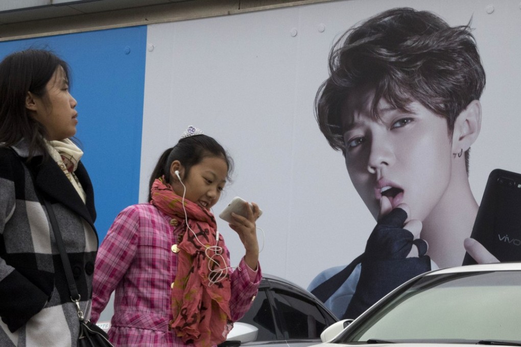 An advertisement featuring teen idol Lu Han in Beijing. Photo: AP