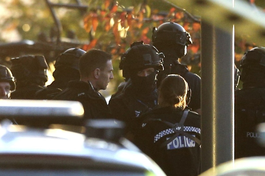 Police attend the scene at Bermuda Park in Nuneaton, central England, during a hostage-taking incident at a bowling alley. Photo: AP