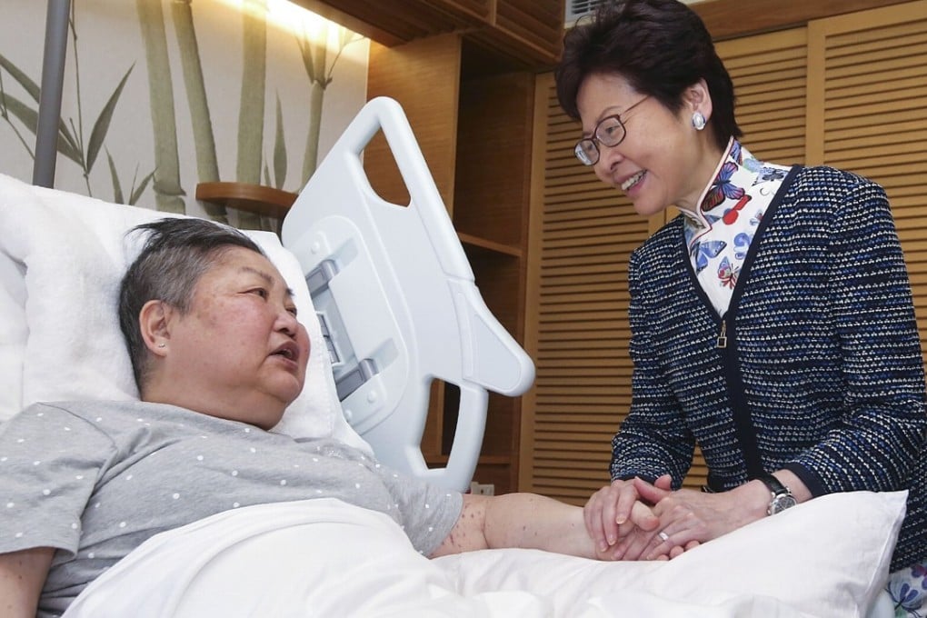 Hong Kong Chief Executive Carrie Lam Cheng Yuet-ngor visits a patient at the opening of the Jockey Club Home for Hospice, in Sha Tin on September 28. Photo: Handout
