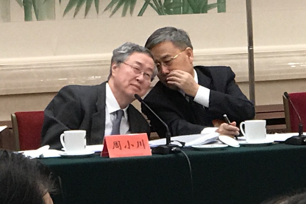 Guo Shuqing (right), who has been touted as a possible future governor of the People’s Bank of China, whispers to its incumbent governor Zhou Xiaochuan during the ongoing party congress in Beijing. Photo: SCMP