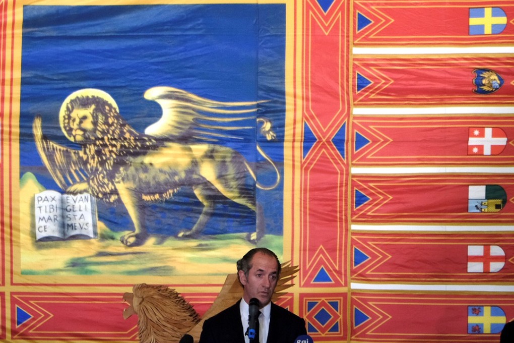 President of Italy’s Veneto region Luca Zaia speaks with journalists as he waits the results of Veneto's autonomy referendum in Venice on Sunday. Photo: Reuters