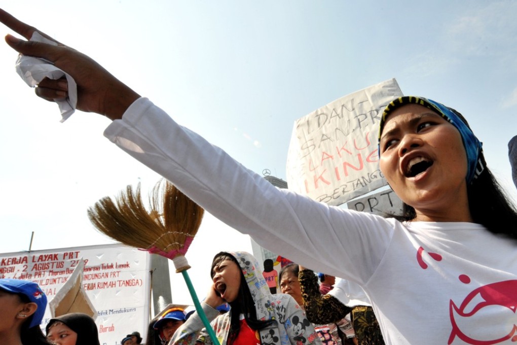 Indonesian women shout slogans during a rally in Jakarta demanding the Indonesian government protect overseas maids and migrant workers from abuse. Photo: AFP