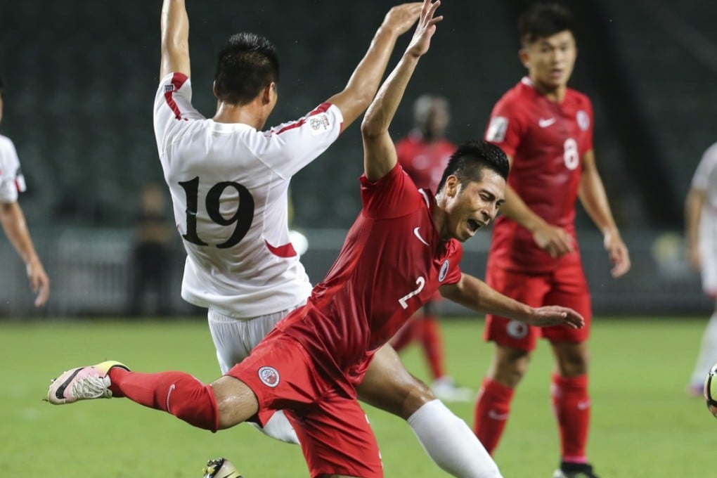 Action between Hong Kong (red) and North Korea in Asian Cup qualifiers. Photo: Felix Wong