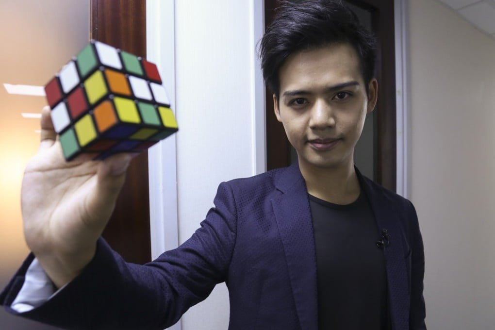 Young magician Henry Harrius knows a few cool tricks with a Rubik’s Cube. Photo: Jonathan Wong