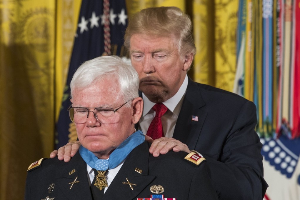 US President Donald Trump awards the Medal of Honour to US States Army Captain Gary Rose. Photo: EPA