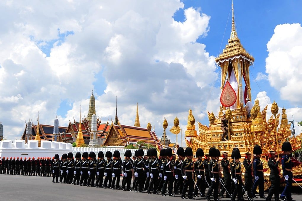 Honour guards escort a royal chariot which will be used to carry the body of the late Thai King Bhumibol Adulyadej, during a rehearsal for the funeral. Photo: Xinhua