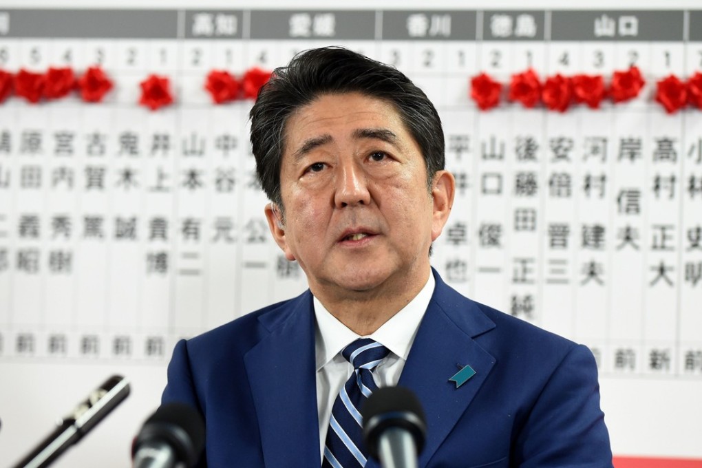 Japan's Prime Minister and ruling Liberal Democratic Party leader Shinzo Abe answers questions at the party headquarters in Tokyo. Photo: AFP