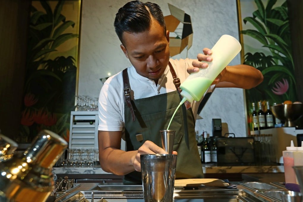 Bartender Agung Prabowo mixes a Death In The Afternoon cocktail at The Old Man in Central. Photo: Nora Tam