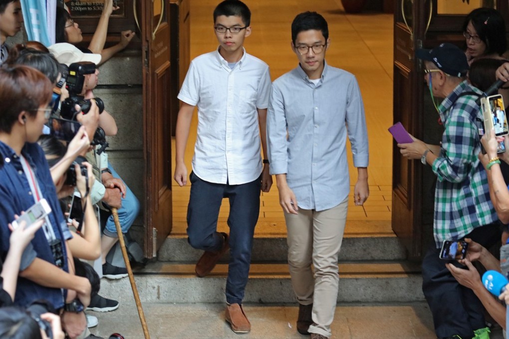 Joshua Wong (left) and Nathan Law Kwun-chung leave the Court of Final Appeal after being released on bail. Photo: Felix Wong