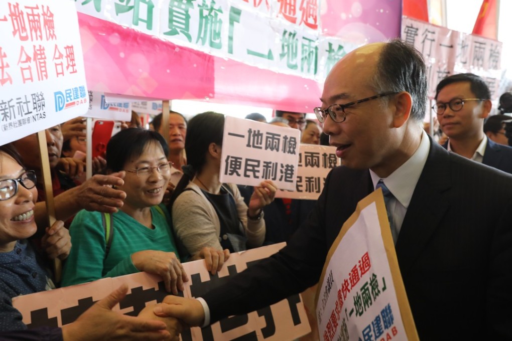Transport secretary Frank Chan Fan greets people outside the Legislative Council who turned out to support the co-location checkpoint. Photo: Sam Tsang