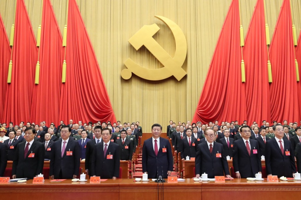 Xi Jinping flanked by Hu Jintao (left) and Jiang Zemin (right) at the closing session of the 19th National Congress. Photo: Xinhua