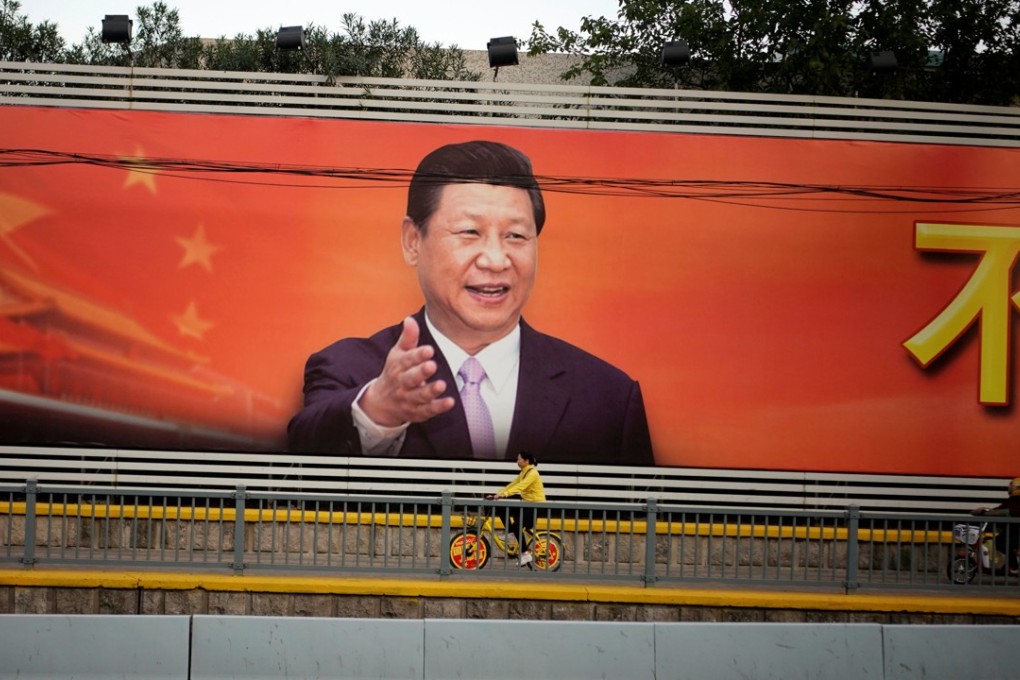 A poster with a portrait of President Xi Jinping is displayed along a street in Shanghai, on October 24. A political system that is highly centralised, ideologically driven, under one charismatic, almost all-powerful leader, with striking ambitions of global military grandeur and influence, carries its own dangers. Photo: Reuters