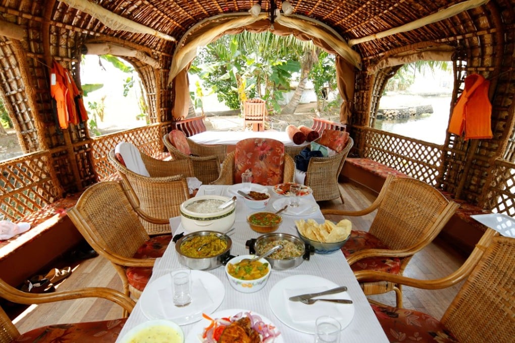The dining area in a luxury houseboat in Alappuzha. Pictures: Alamy