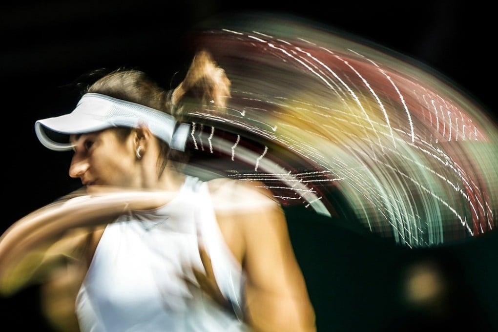 Caroline Garcia of France in action against Elina Svitolina of Ukraine during their round robin match at the WTA Tour Finals. Photo: EPA