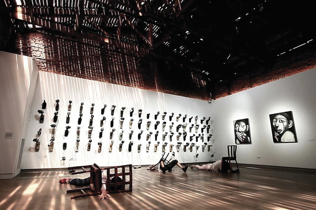 Artworks at the “Why Do We Sing: War and Women” exhibition at the Jockey Club Creative Arts Centre, in Shek Kip Mei.