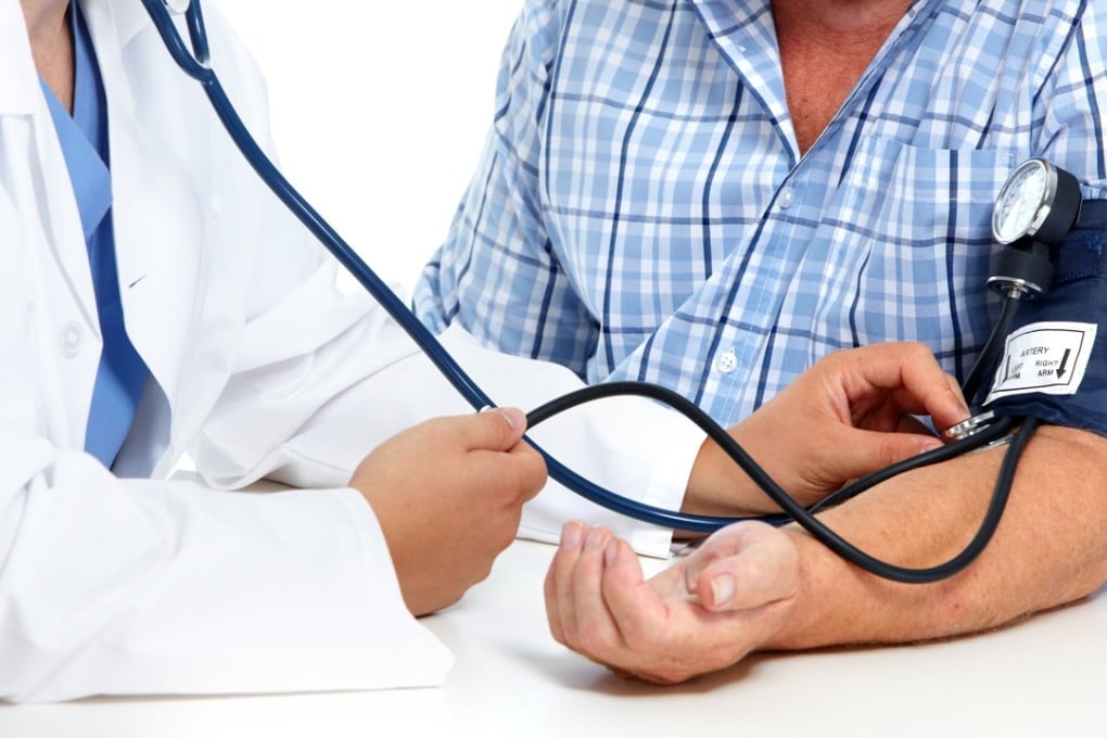 A doctor checks an elderly man’s blood pressure. Strokes, with high blood pressure one of the contributory factors, are one of the main causes of death in China. Photo: Shutterstock