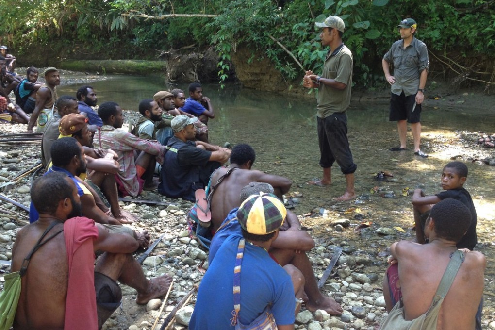 Researchers address Aitape residents. Photo: AFP