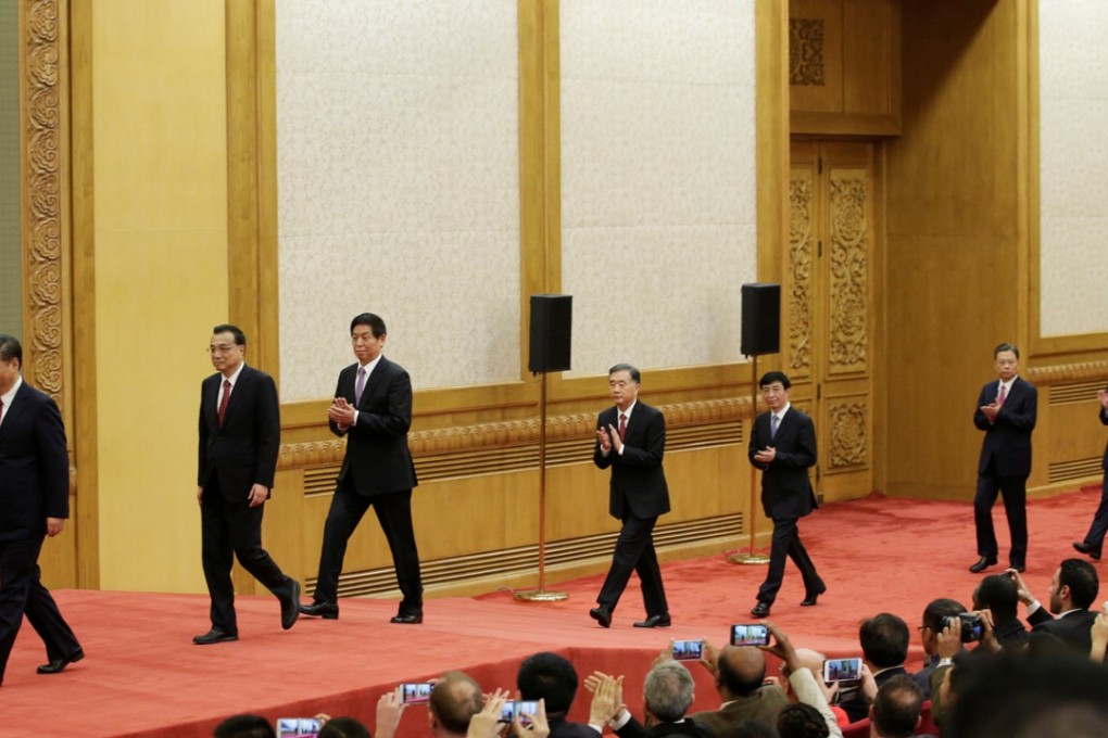 China's new Politburo Standing Committee members arrive to meet with the press at the Great Hall of the People in Beijing. Photo: Reuters