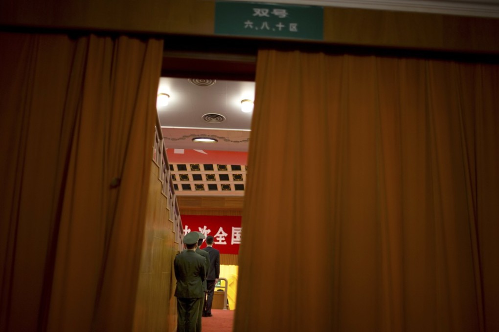 Security personnel stand on guard before the closing ceremony of the Communist Party congress. Photo: AP
