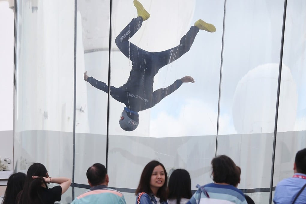 A tourist tries the Indoor Skydiving facility on the cruise ship Ovation of the Seas at the Kai Tak Cruise Terminal. Photo: Dickson Lee