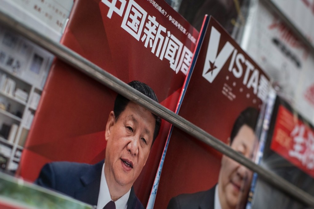 The front cover of magazines showing Chinese President Xi Jinping are placed for sale at a newspaper stall in Beijing, on October 26. Photo: EPA