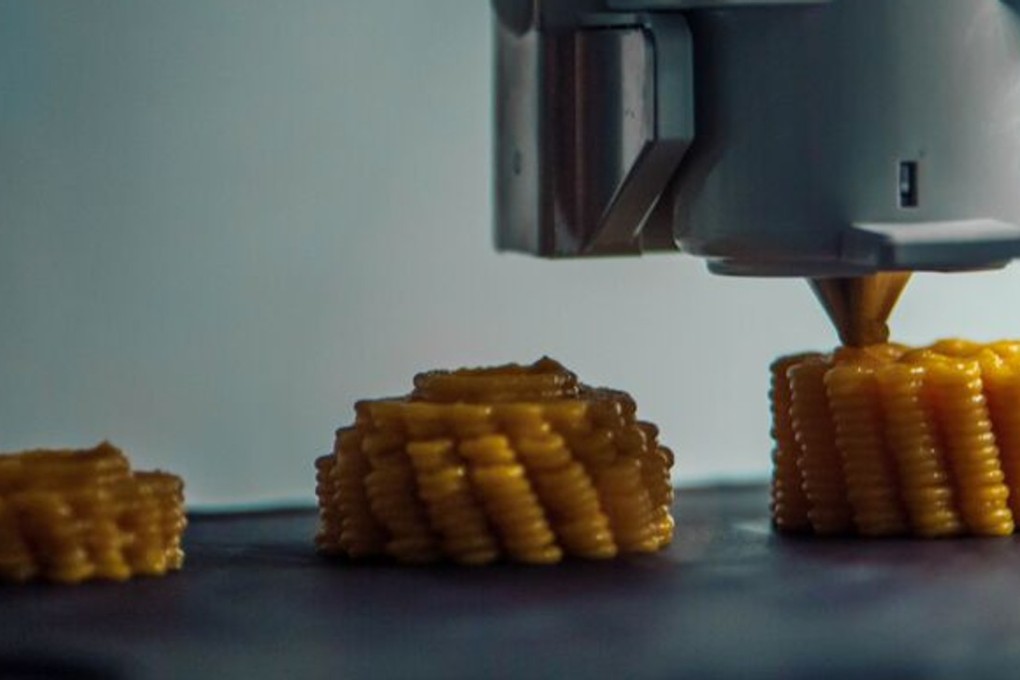 A Foodini 3D printer creates a corn-on-the-cob dish – an invention Natural Machines hopes will one day become as commonplace in the kitchen as a microwave. Photo: Natural Machines