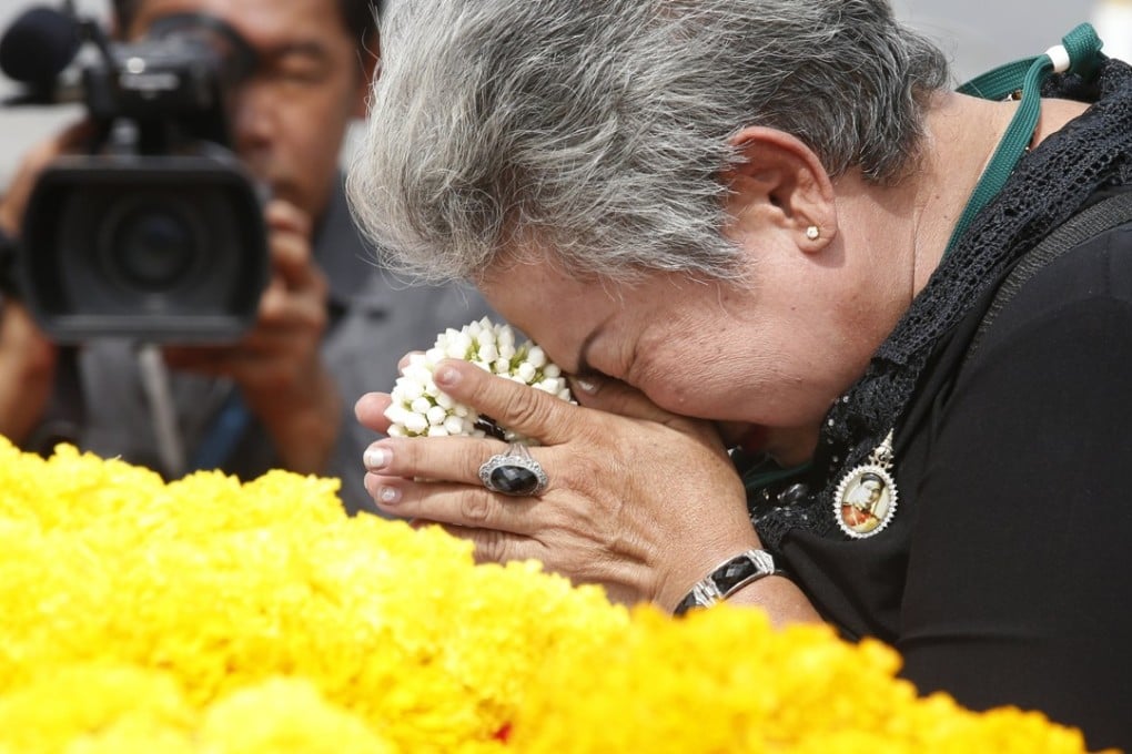 A Thai mourner pay respects to the late Thai King Bhumibol Adulyadej. Photo: EPA