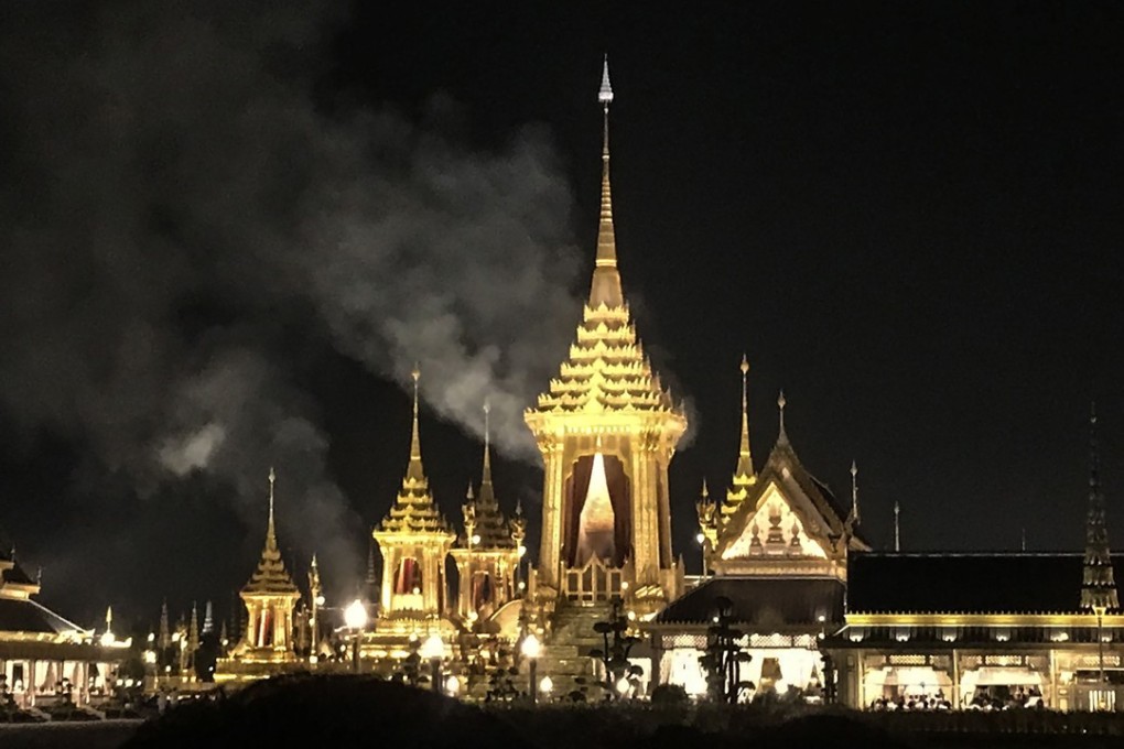 Smoke rises from the main pavilion where the body of late Thai King Bhumibol Adelyadej was being cremated late on Thursday in Bangkok. Photo: AFP
