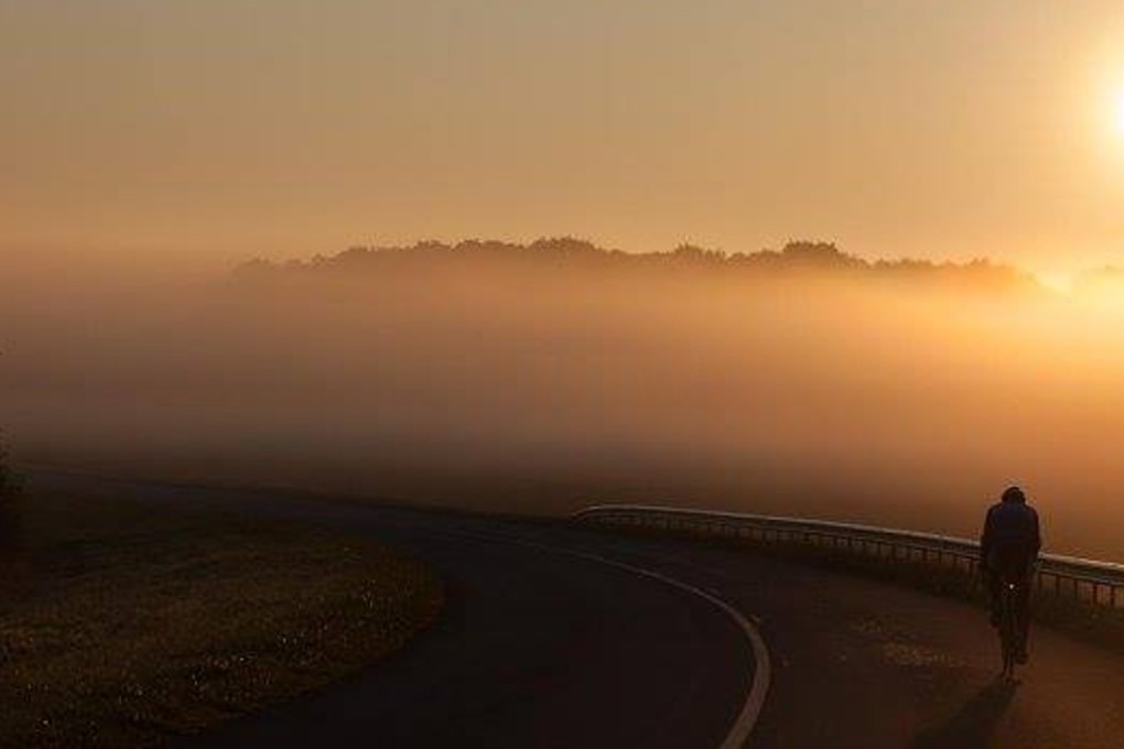 Mark Beaumont watches his final sunrise as he cycles towards Paris on the last day of his world record ride. Photos: Mark Beaumont Facebook