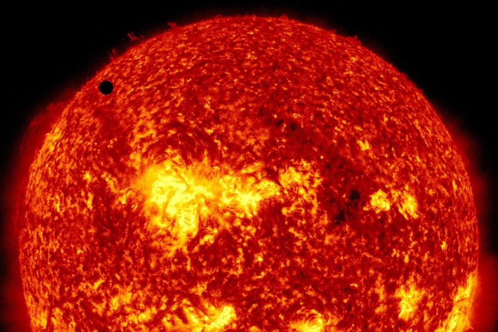 Not the mysterious object, but Venus appearing as a small black dot against the massive surface of the Sun on its orbit between Earth and the centre of our solar system. Photo: EPA