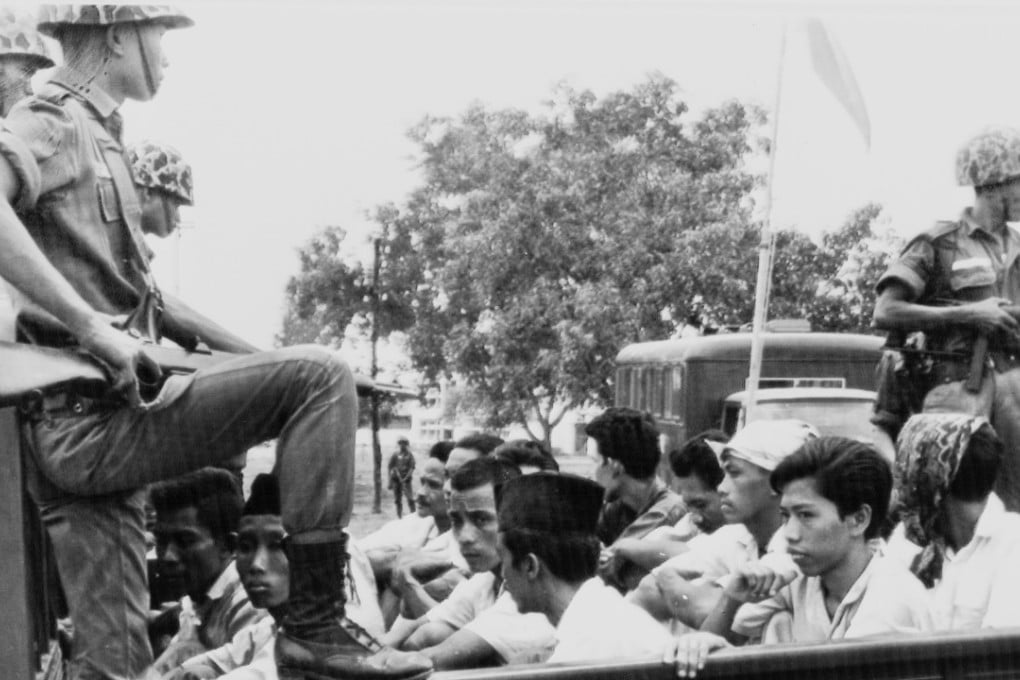 Members of the youth wing of the Indonesian Communist Party are taken to prison in 1965. Photo: AP