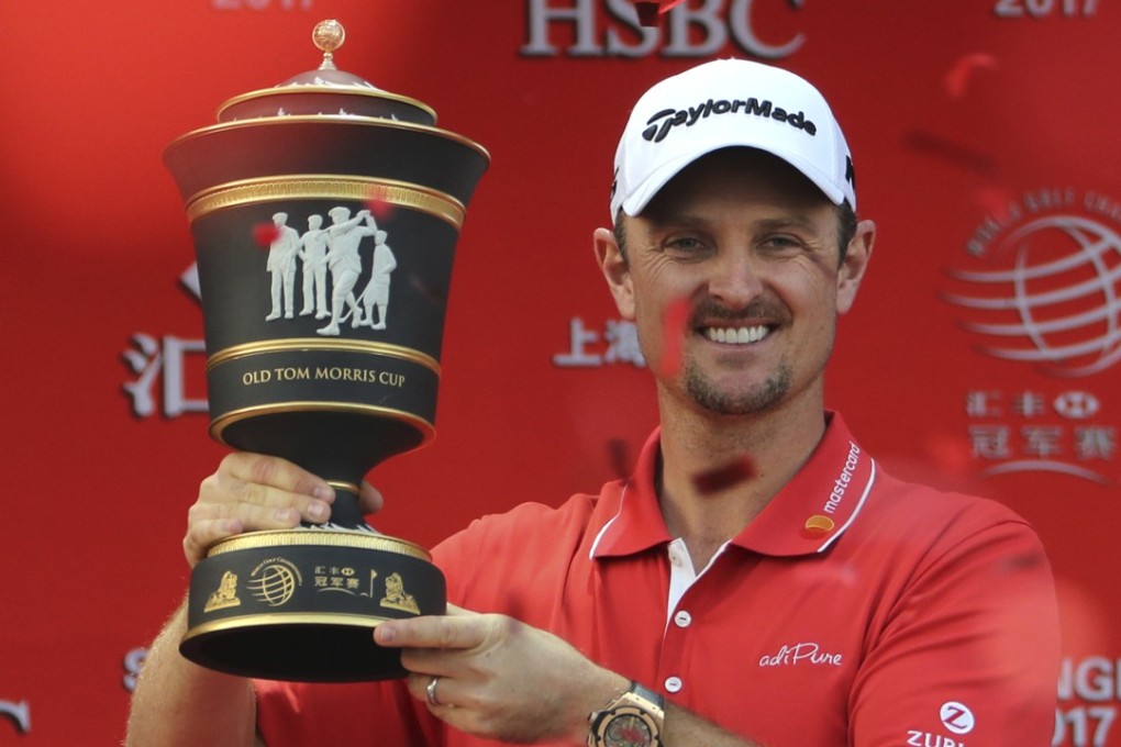 Justin Rose celebrates with the trophy after winning the WGC-HSBC Champions at the Sheshan International Golf Club in Shanghai. Photo: AP
