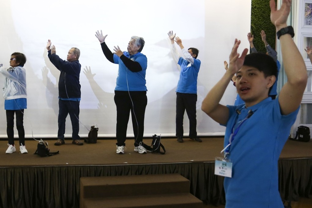 Sufferers of chronic obstructive pulmonary disease, a lung condition, exercise with their oxygen devices at the launch of a campaign to raise public awareness and improve their rights. Photo: Jonathan Wong