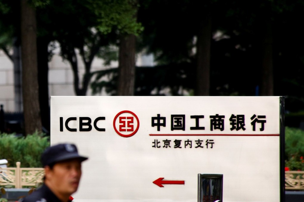 A security guard in front of the headquarters of the ICBC bank in Beijing. China’s largest bank by assets, said net profit rose 3.4 per cent on year to 75 billion yuan for the three months through September. Photo: Reuters