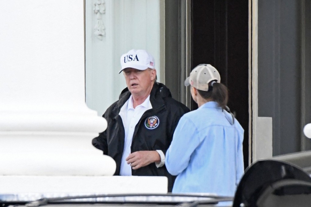 US President Donald Trump walks out of the North portico of the White House on Saturday. Photo: EPA