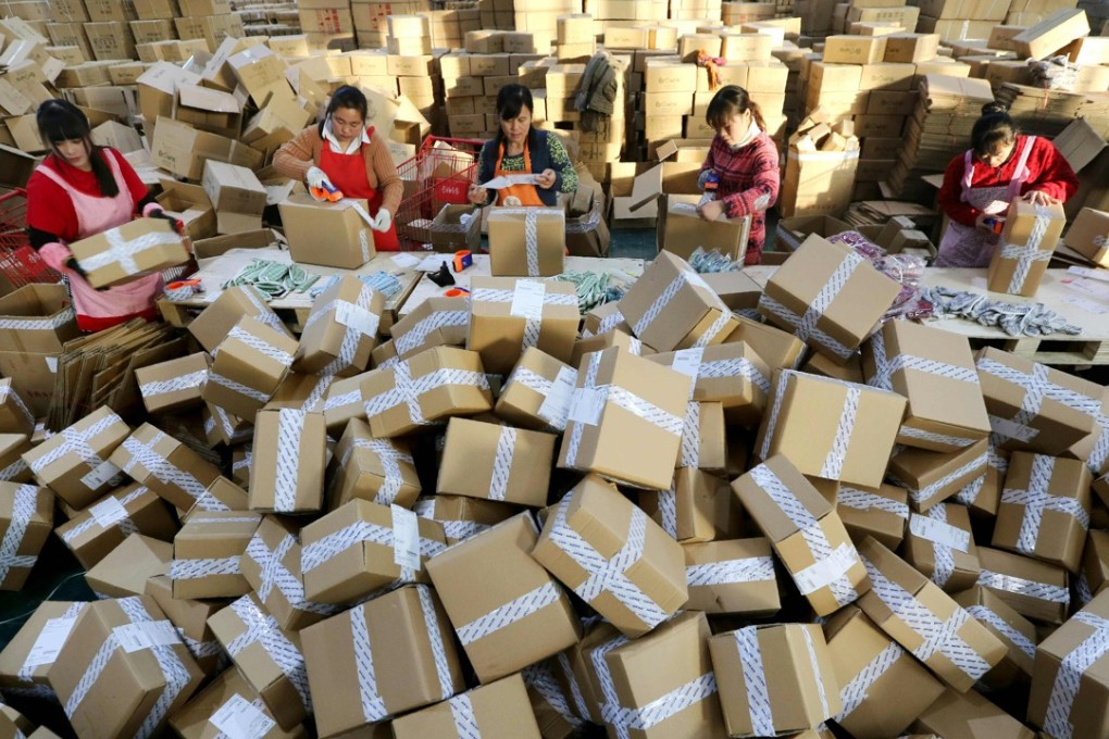 Package handlers prepare deliveries at a sorting centre in Lianyungang, Jiangsu province during the Singles’ Day online shopping festival last November. Photo: AFP