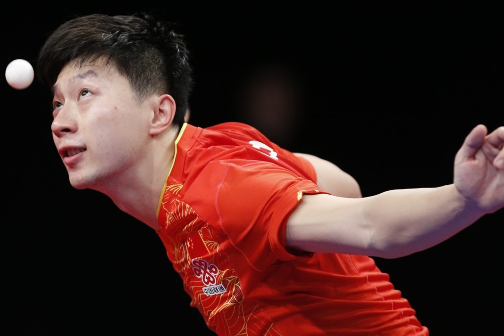 Ma Long serves against France’s Simon Gauzy at the ITTF Men’s World Cup in Liege. Belgium. Xinhua